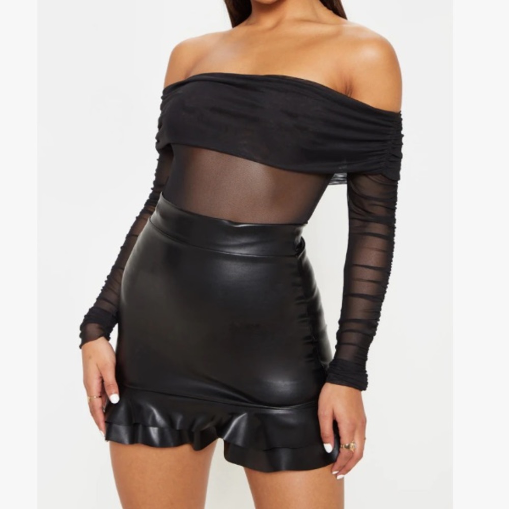 Black faux leather grilled hem mini skirt